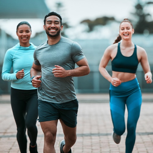 Active couple jogging, representing life after regenerative treatment