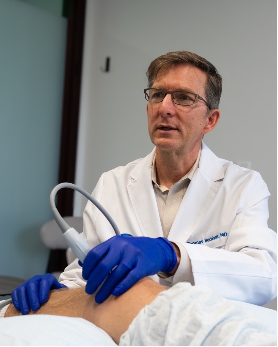 Dr. Buchheit performing a regenerative medicine procedure